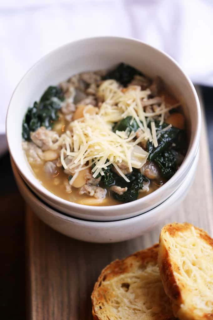 Sausage Kale Soup with White Beans is a rustic, delicious, quick and easy soup that can be on the table in less than thirty minutes! kale recipes | kale recipes soup | kale soup