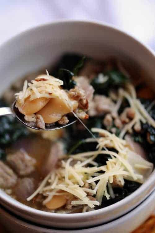 Sausage Kale Soup with White Beans is a rustic, delicious, quick and easy soup that can be on the table in less than thirty minutes! kale recipes | kale recipes soup | kale soup