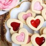 Raspberry Cookie Sandwiches are soft raspberry filled cookies made from sugar cookies filled with your choice of raspberry jam or fresh raspberry buttercream frosting.
