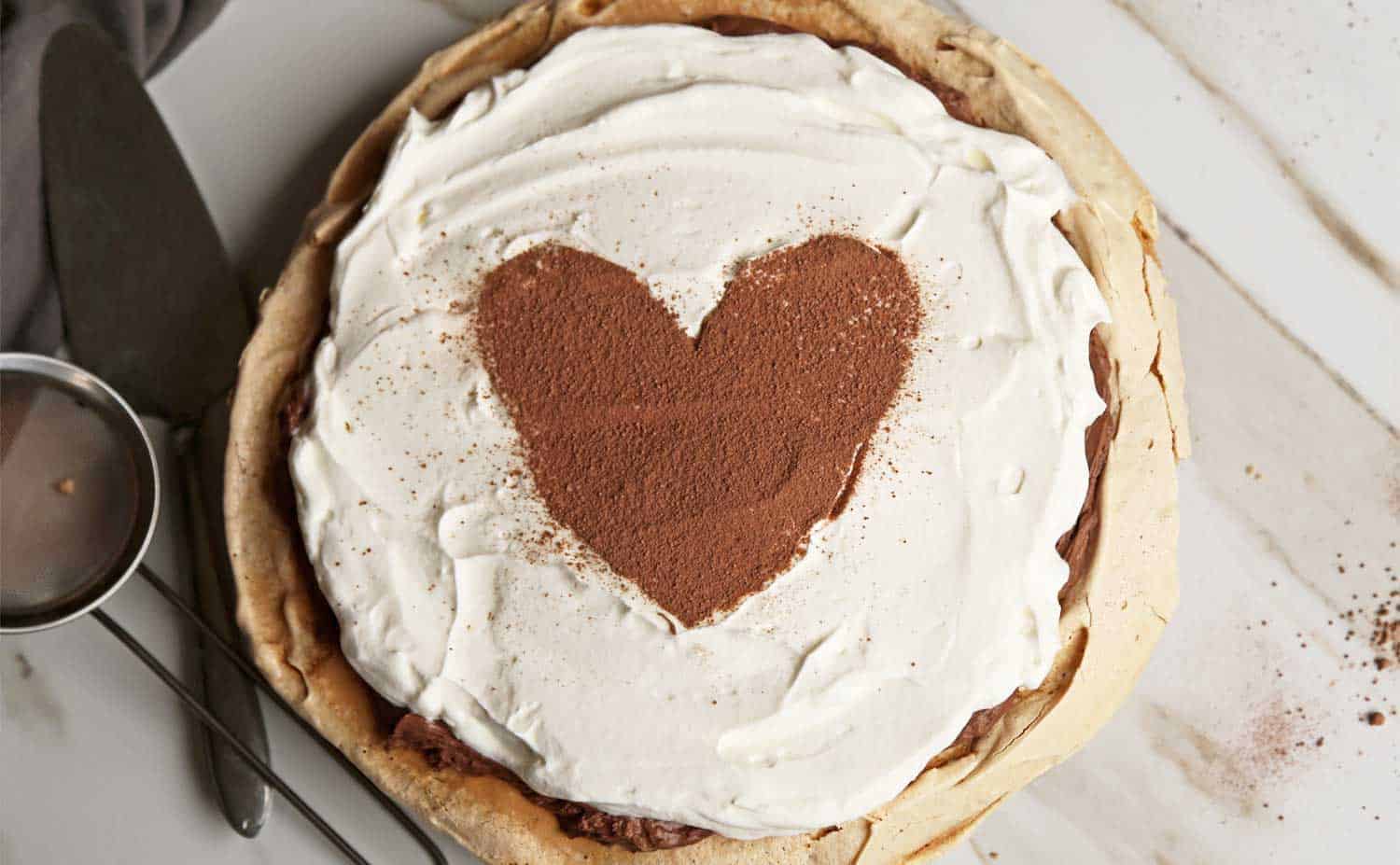 Chocolate Angel Cream Pie is a chocolate pie recipe with a light and airy gluten free pie crust made from meringue and a delicious chocolate cream pie filling made from chocolate mousse and freshly whipped cream. chocolate pie recipe| gluten free pie | chocolate cream pie recipe