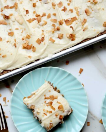 Coconut Carrot Sheet Cake is a moist carrot cake recipe made with coconut oil and cream cheese icing. Cut into squares it's the perfect snacking cake or cake for a crowd. carrot cake | carrot cake recipe with cream cheese frosting