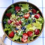 Red, White and Blue Summer Fruit Salad with Creamy Lemon Dressing is the perfect light, refreshing summer salad to bring to parties, picnics and potlucks. fruit salad recipe | strawberry salad | summer salad lemon dressing | potluck recipe | picnic salad