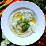 Whipped feta dip with herbs served with fresh vegetables.