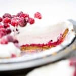 Cranberry cream pie with a layers of cranberry custard, cranberry cream and lemon whipped cream topped with sugared cranberries.
