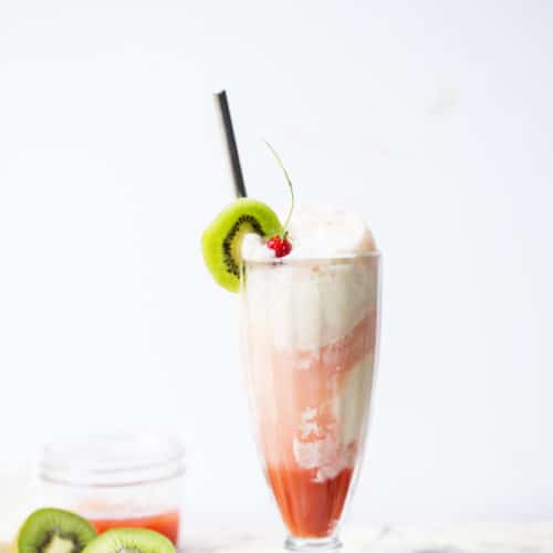 Sweet, refreshing and completely decadent you would never believe this Strawberry Kiwi Cream Float is made completely without soda! #GetFizzy @SparklingIce #ad soda replacement | fruit floats | fruity ice cream float