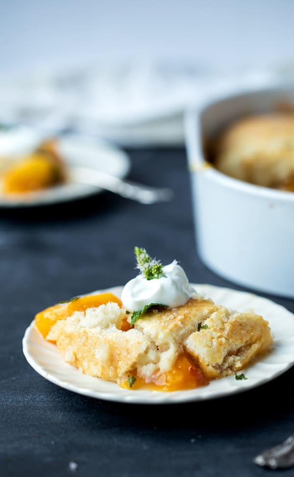 Spiced Fresh Peach Cobbler with a fluffy, biscuit-like topping like grandma (and mom) used to make! peach cobbler recipe without oats, brown sugar, cornstarch | homemade bisquick topping | cake like cobbler topping like grandma #easy #cobbler #recipe