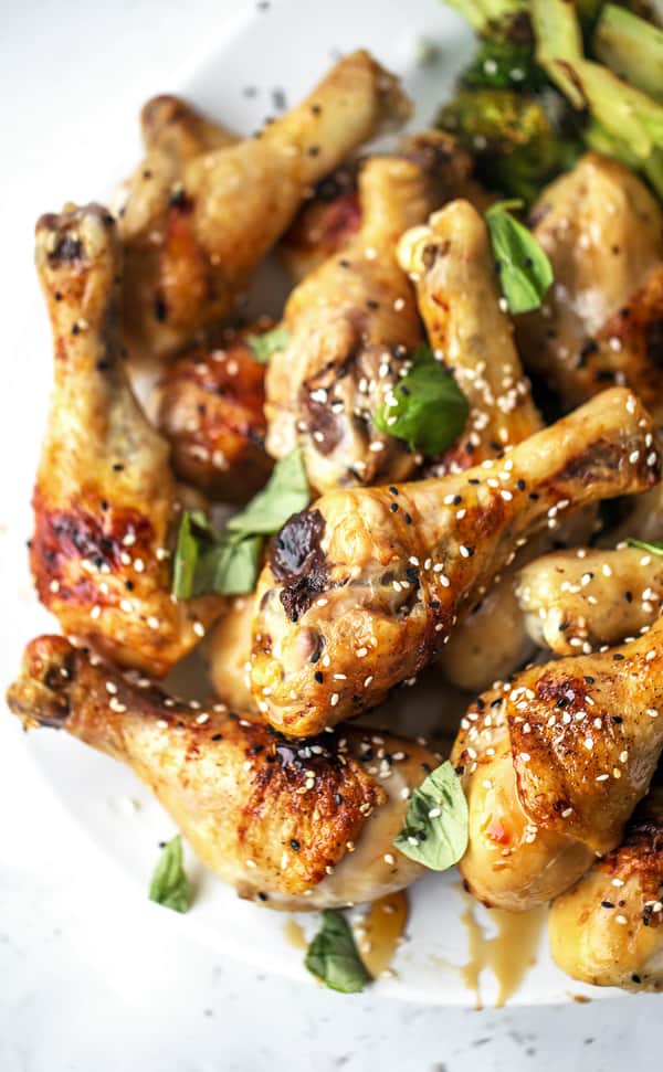 Baked Honey Ginger Chicken is an easy weeknight dinner recipe with tender meat, crispy skin and big flavor! baked chicken | legs breast thigh tenders tenderloins | recipes | honey baked chicken | soy | garlic | glazed | easy chicken recipes for dinner | gluten free | baked chicken for a crowd