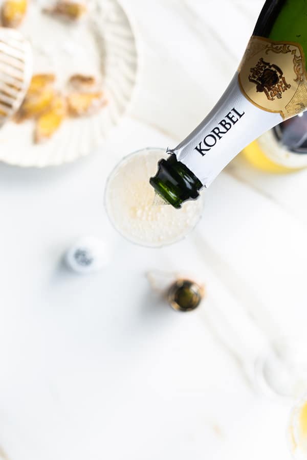 With a simple ginger infused simple syrup on hand it’s easy to celebrate (anytime!) with festive cocktails like the Ginger Sparkler! ginger | ginger cocktails | uses for ginger | ginger cocktail syrup | champagne cocktails | new years drink | fresh ginger cocktails
