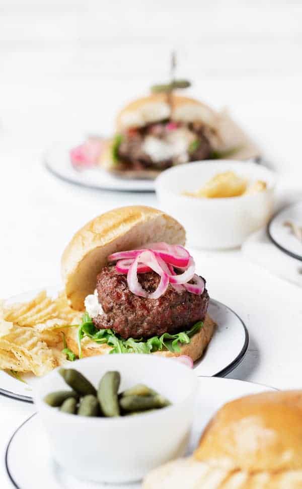 Whether grilling in the campground, on the patio, or over the stove top, Chèvre-Stuffed Burgers with Onion Jam and Arugula are delicious, unexpected, and sure to impress. How to make stuffed burgers | chevre goat cheese recipes | @Montchevre® #ad