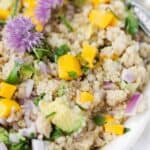 Mango Avocado Quinoa Salad mixes juicy mangoes and creamy avocado with a bright lemon dressing and loads of fresh herbs. A delish way to use up leftover quinoa! Mango Avocado Quinoa Salad | quinoa recipe | how to make quinoa salad | mango salad | quinoa salad dressing | easy vegan quinoa salad recipe