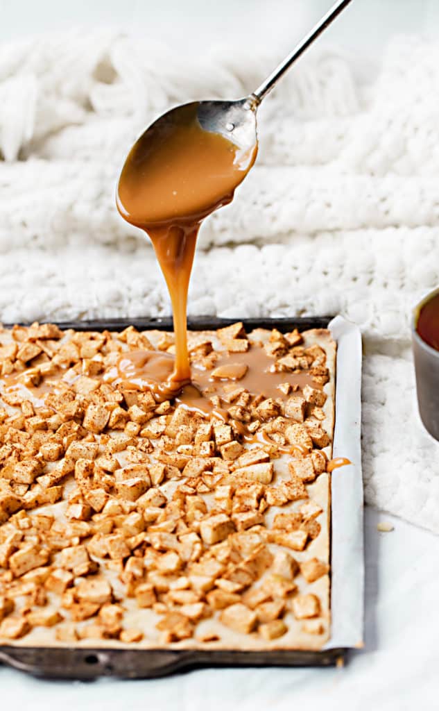 Caramel Apple Pie Bars are a complete showstopper handheld dessert with buttery shortbread crust, caramel apple filling and finished with a mile-high crumble topping. apple slice sheet pan recipe | salted caramel apple pie bars dessert