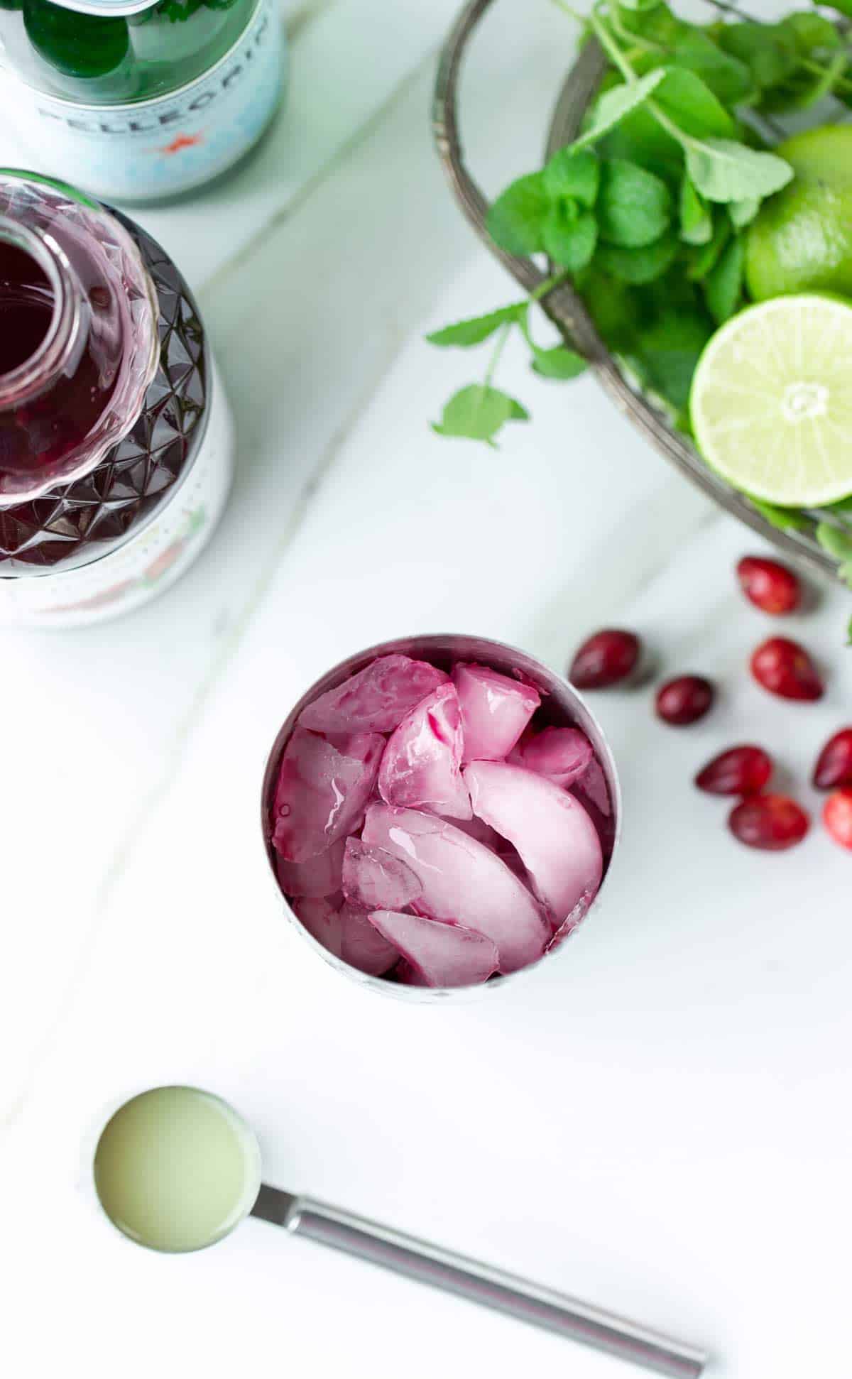 Top down view of cranberry mint cocktail in a cocktail shaker