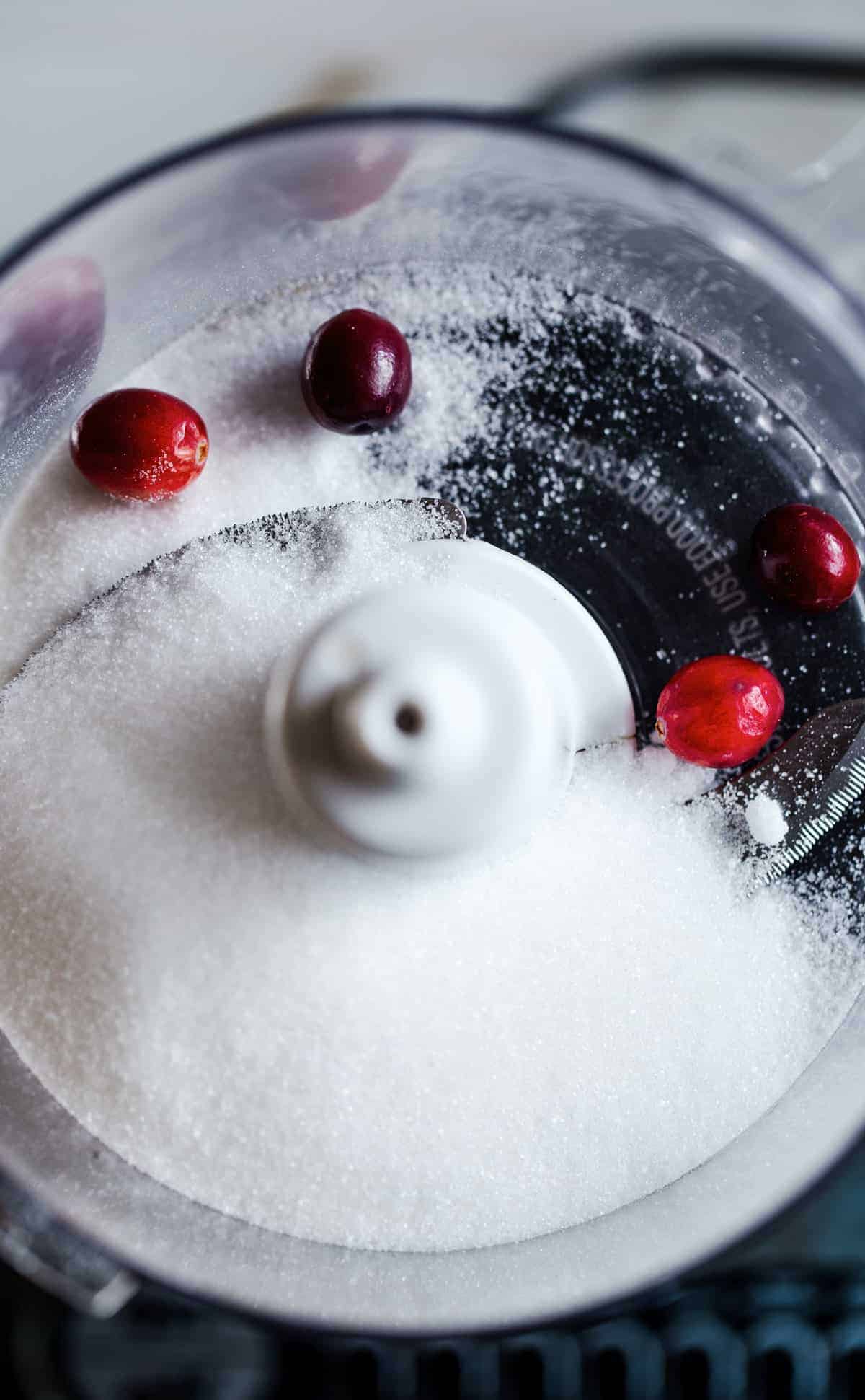 Homemade Cranberry Sugar is a naturally colored sugar that adds a festive touch to holiday cocktails, mocktails, desserts and more! 
