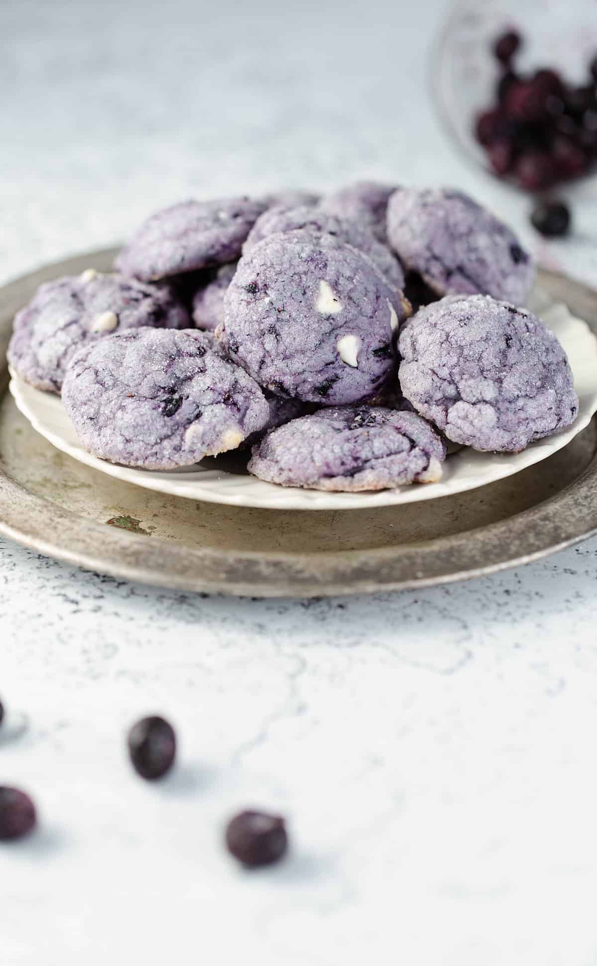 Blueberry cookies on a tray after being cooked and rested.