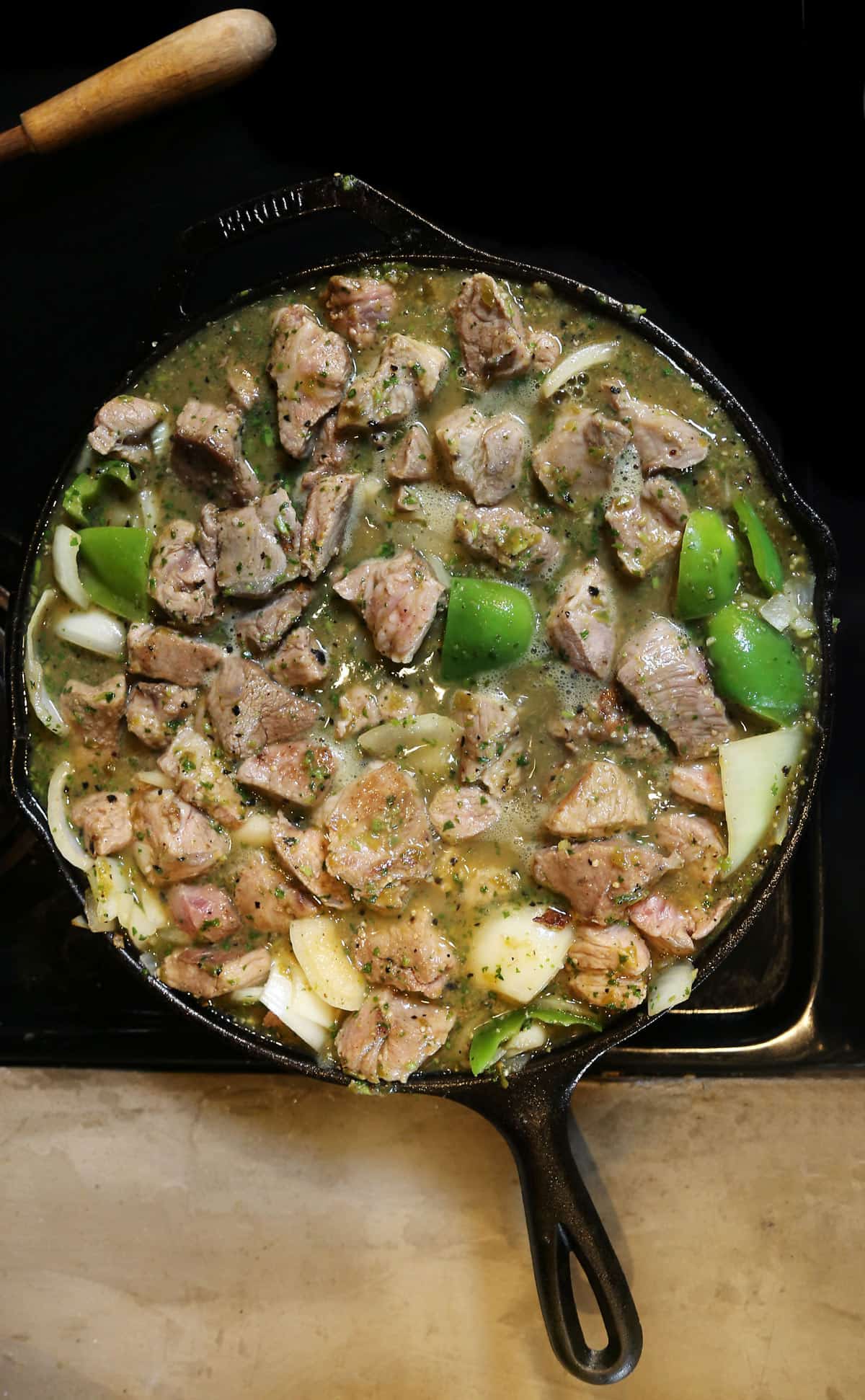 Chile Verde Pork is a green chili with pork that's simmered until melt-in-your-mouth tender in a rich stew of smoky roasted tomatillos, onions, chilis and herbs like cilantro and oregano. chile verde recipe | chili verde | chile verde pork