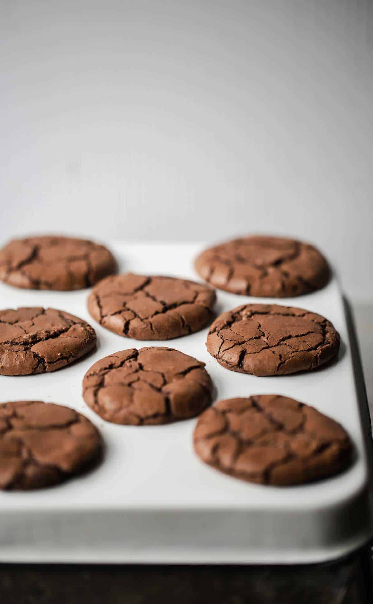 Chocolate Brownie Crinkle Cookies are a quick no chill chocolate crinkle cookies recipe with a rich fudgy interior and crisp brownie like crust with deep crinkles and crackly texture. Brownie cookies recipe | chocolate crinkle cookies