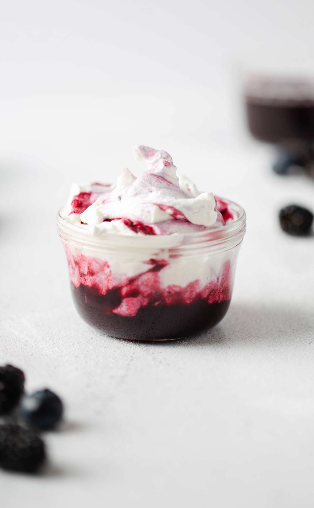 Berry Whipped Cream is a delicious fluffy homemade sweet treat that can be used as a dip, filling, frosting and more. blueberry whipped cream | berry cream | berries and cream