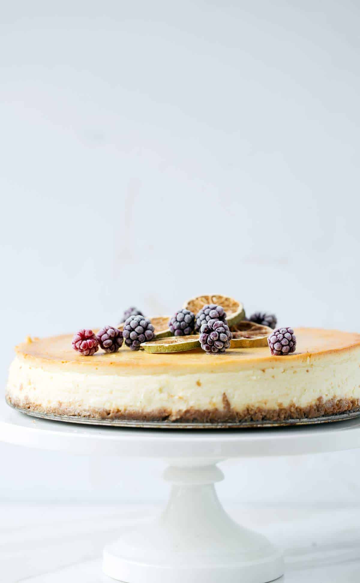 Churro Cheesecake with Cinnamon Toast Crunch crust and creamy lemon lime cheesecake filling is delicious with blackberry sauce topping. churro cheesecake | churro cheesecake recipe | cinnamon toast crunch recipes | cinnamon cheesecake | lemon lime cheesecake