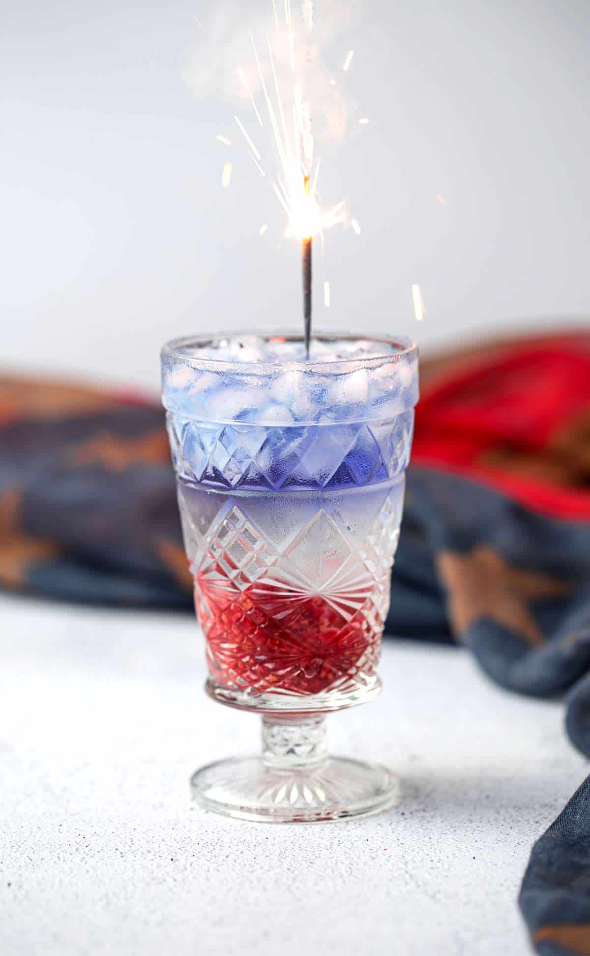 The 1776 Red, White and Blue 4th of July Cocktail made from fresh ingredients and naturally blue Empress 1908 Gin. red white and blue cocktail | drinks for 4th of july | 4th of july cocktails 