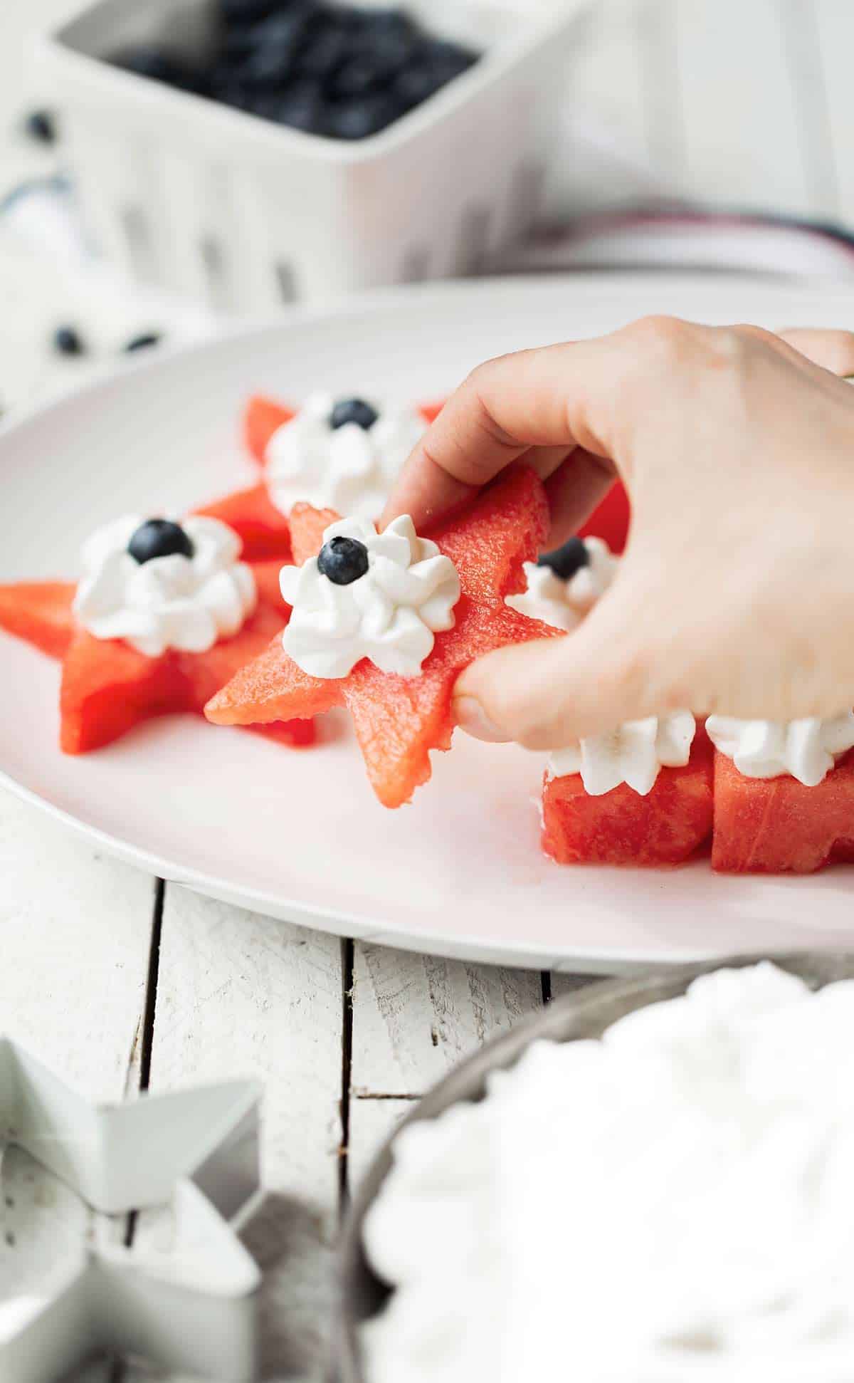 Watermelon Fruit Salad Bites are a delicious refreshing watermelon salad served as a bite sized red, white and blue appetizer. fruit salad | watermelon salad | fourth of july fruit salad