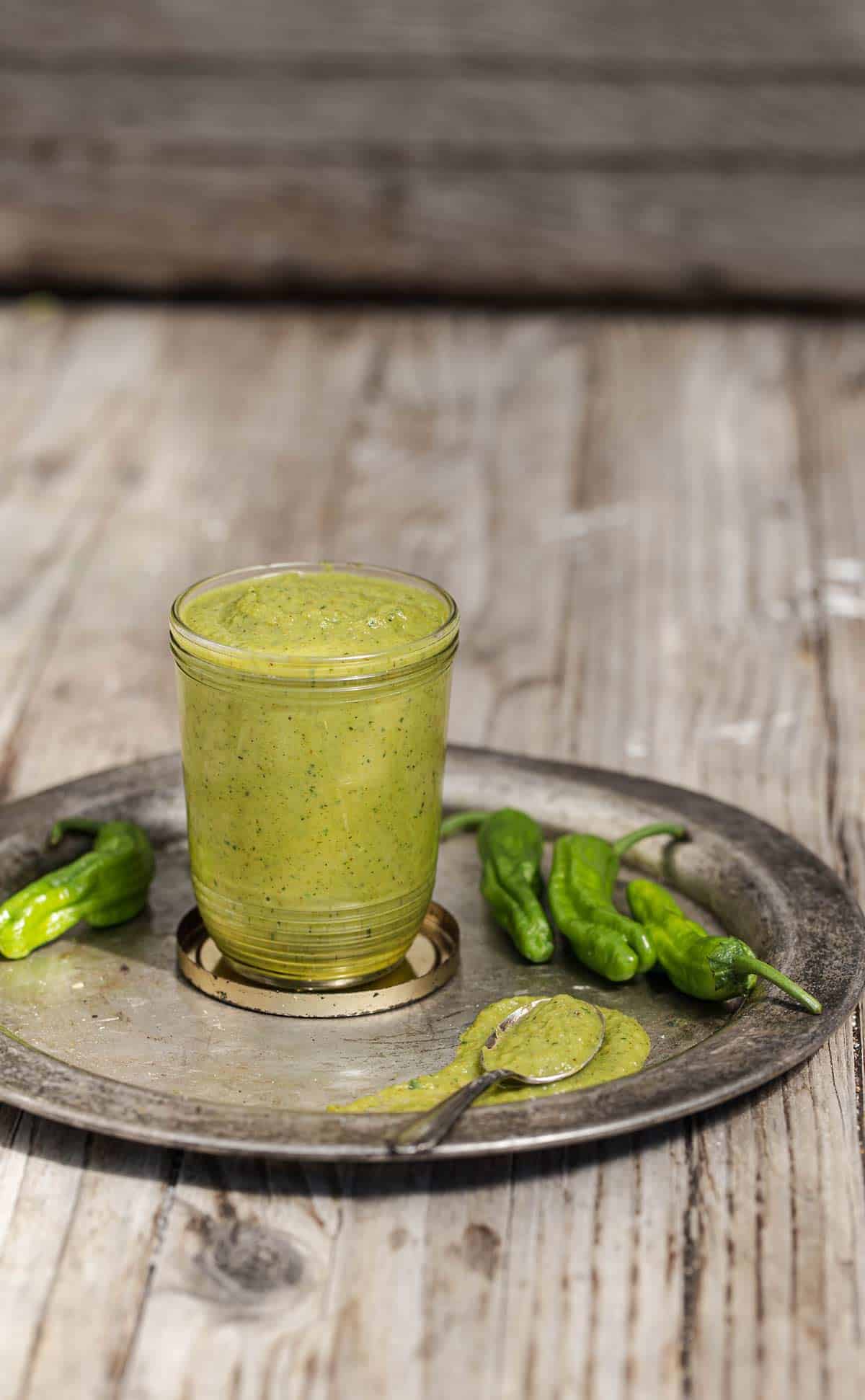 Blistered Shishito Pepper Sauce is a tangy all purpose green sauce recipe that adds bright shishito pepper flavor to all sorts of dishes. shishito peppers | shishito peppers recipe | shishito pepper sauce