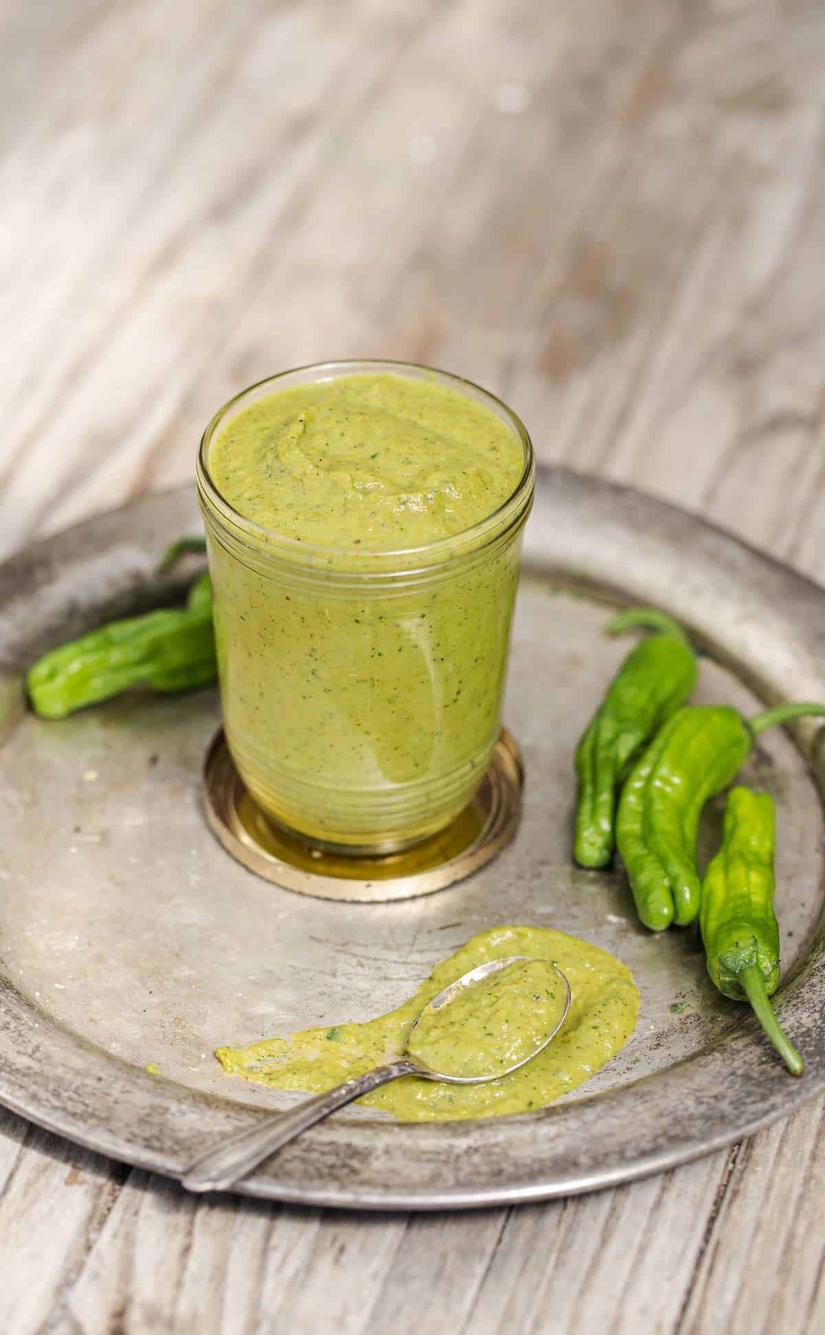 Blistered Shishito Pepper Sauce is a tangy all purpose green sauce recipe that adds bright shishito pepper flavor to all sorts of dishes. shishito peppers | shishito peppers recipe | shishito pepper sauce