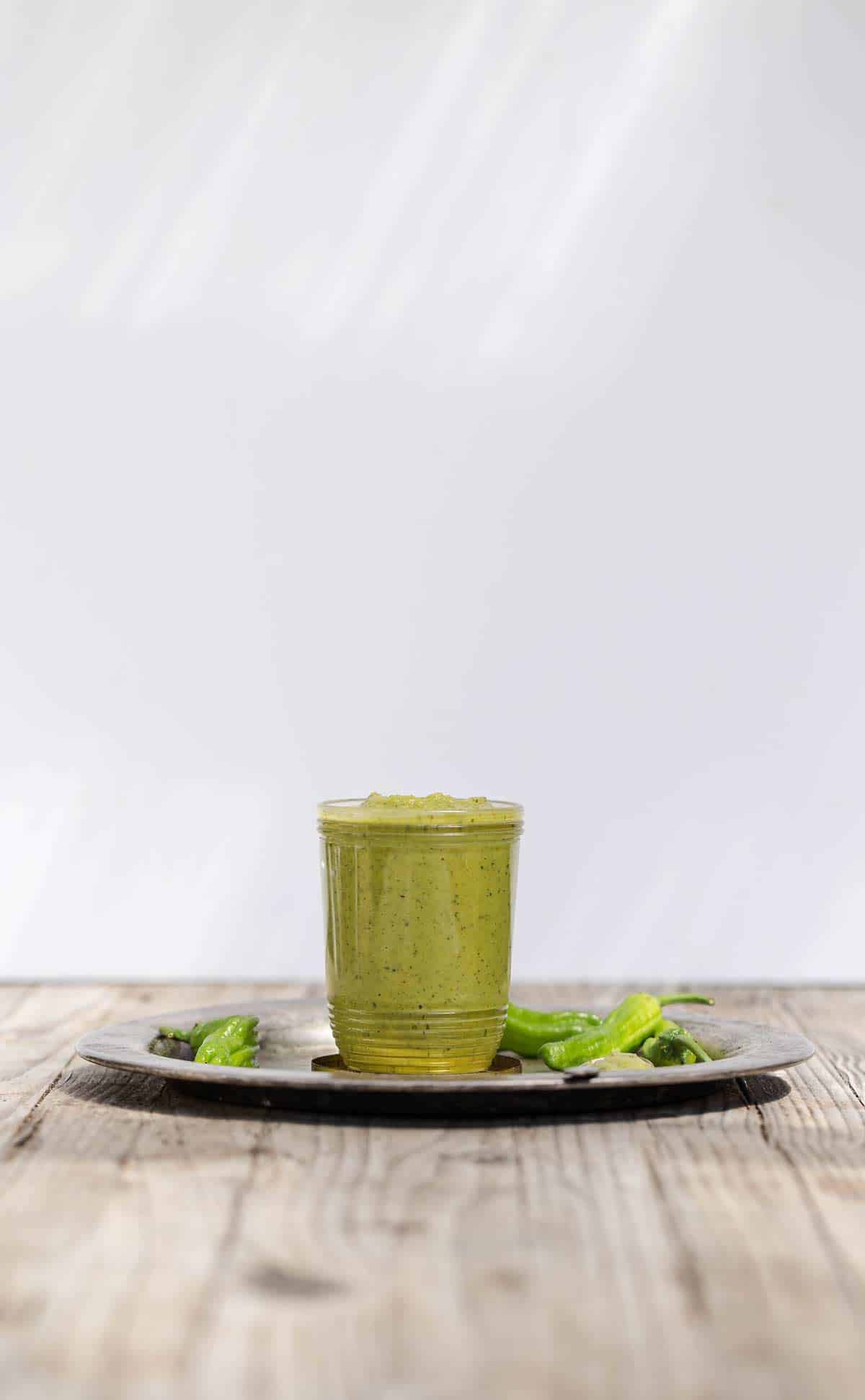 Blistered Shishito Pepper Sauce is a tangy all purpose green sauce recipe that adds bright shishito pepper flavor to all sorts of dishes. shishito peppers | shishito peppers recipe | shishito pepper sauce