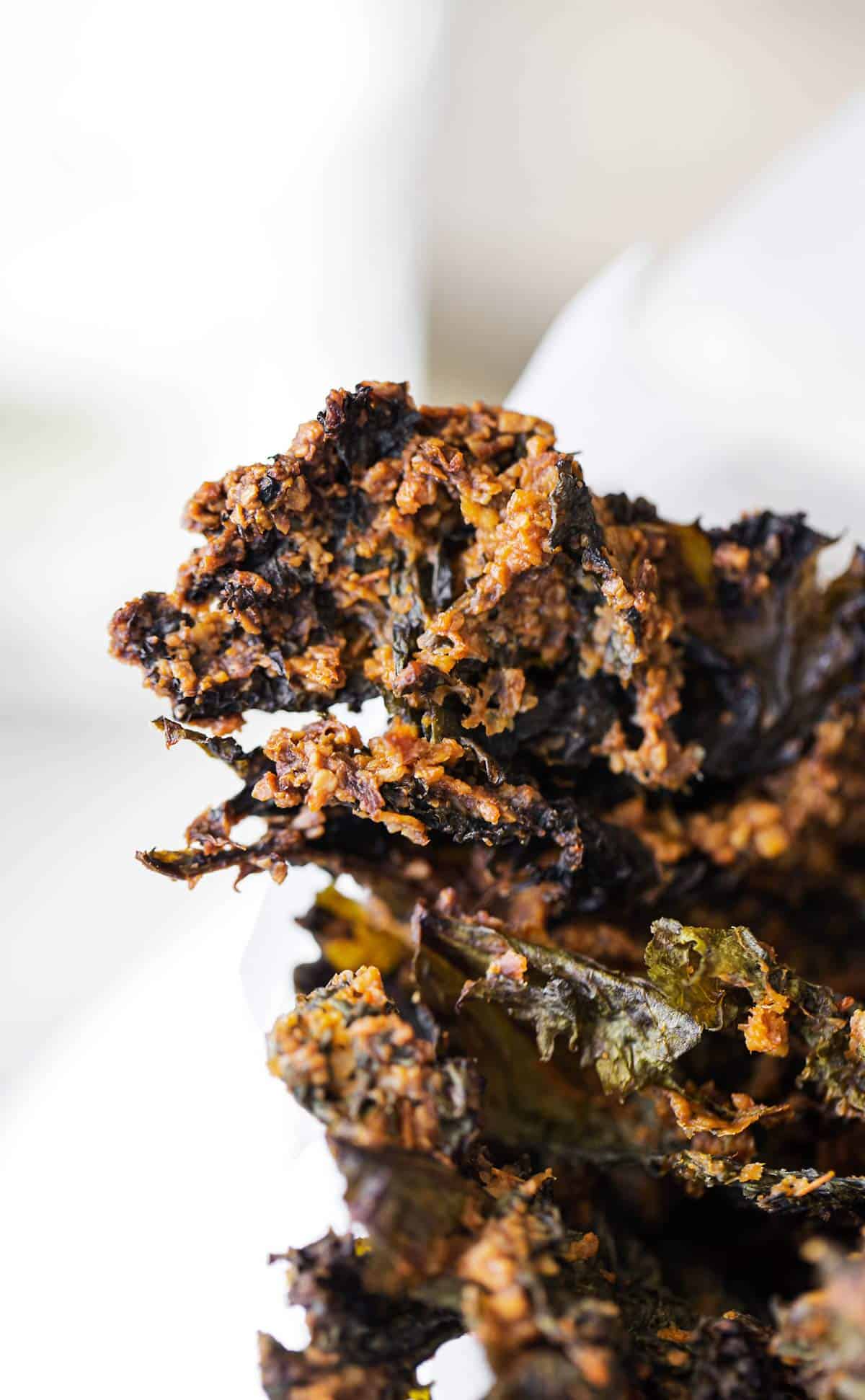 Not-cho 'Cheese' Crispy Kale Chips are oven baked with a zesty nacho-inspired seasoning made from cashews, nutritional yeast, salsa and more. kale chips | kale chips recipe | crispy kale | how to make kale chips | baked kale chips | spicy kale chips | kale chips nutritional yeast