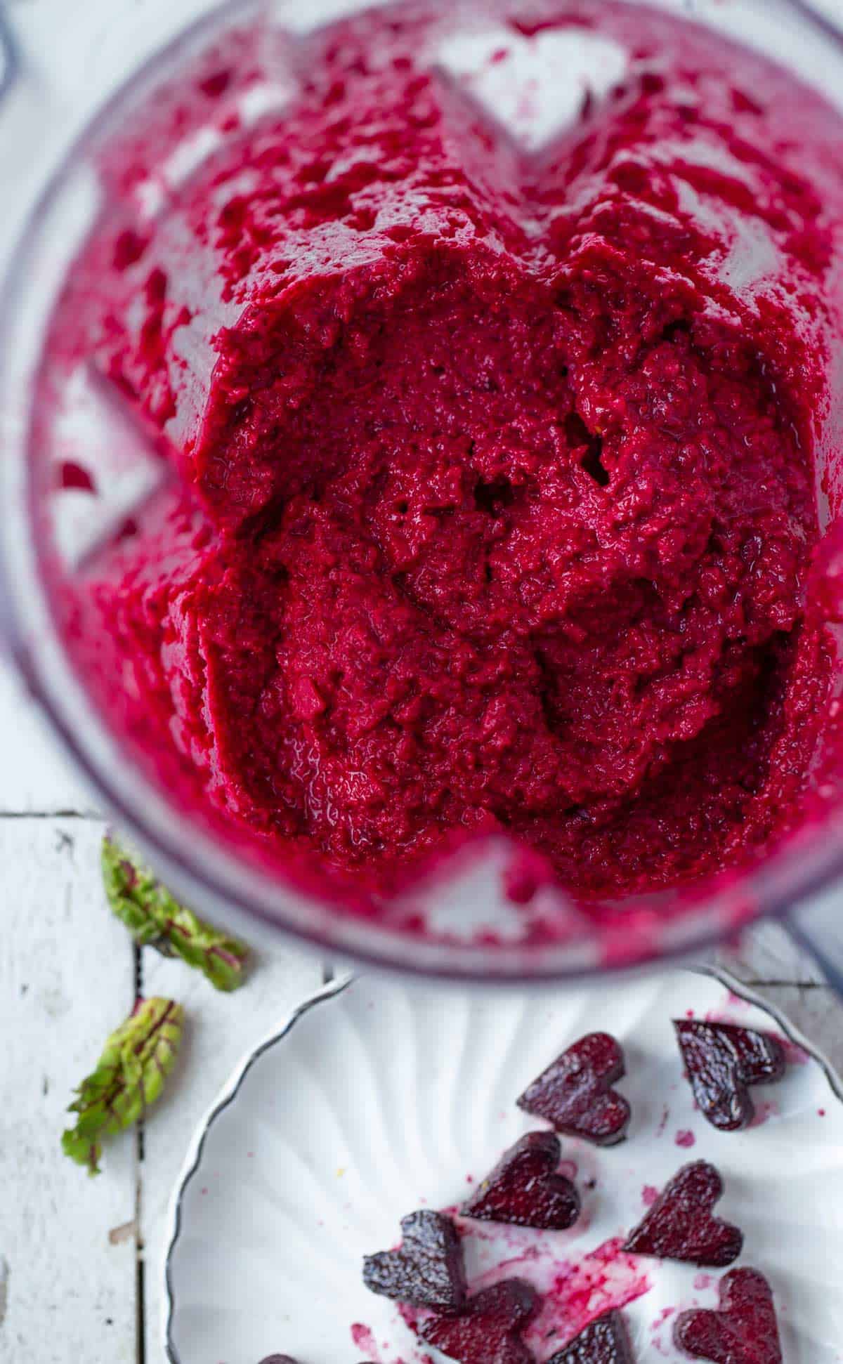 Pink Pesto 'Heart" Beet Pasta is a naturally bright pink pasta recipe made with balsamic roasted beets, beet greens and beetroot pesto. Valentine's day dinner idea | beet pasta | beetroot pesto | beet greens recipe | pink pasta | heart shaped foods
