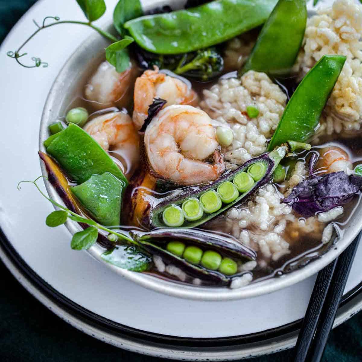 Sizzling Rice Soup is a classic Chinese soup recipe with light flavorful broth, a mixture of proteins and vegetables and crispy puffed rice that sizzles and pops when added to the soup.