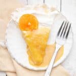 Orange Creamsicle Pavlova Pie is a delicious orange dessert made with a meringue pie crust topped with fluffy vanilla whipped cream and bright citrusy orange curd.