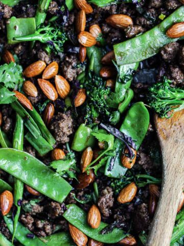 Beef and broccolini stir fry recipe with ground beef, peas and toasted almonds
